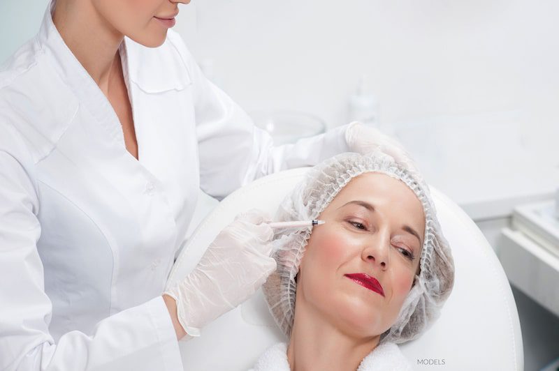 Woman getting BOTOX® Cosmetic for crow's feet.